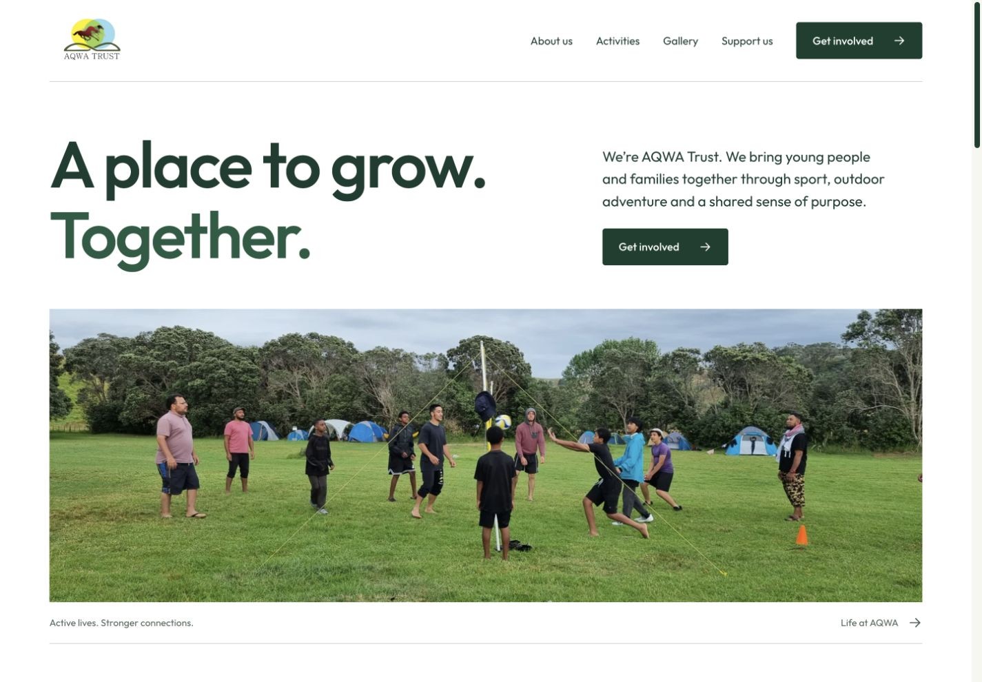 AQWA Trust website redesign with its original logo, green typography and a real community camp photograph